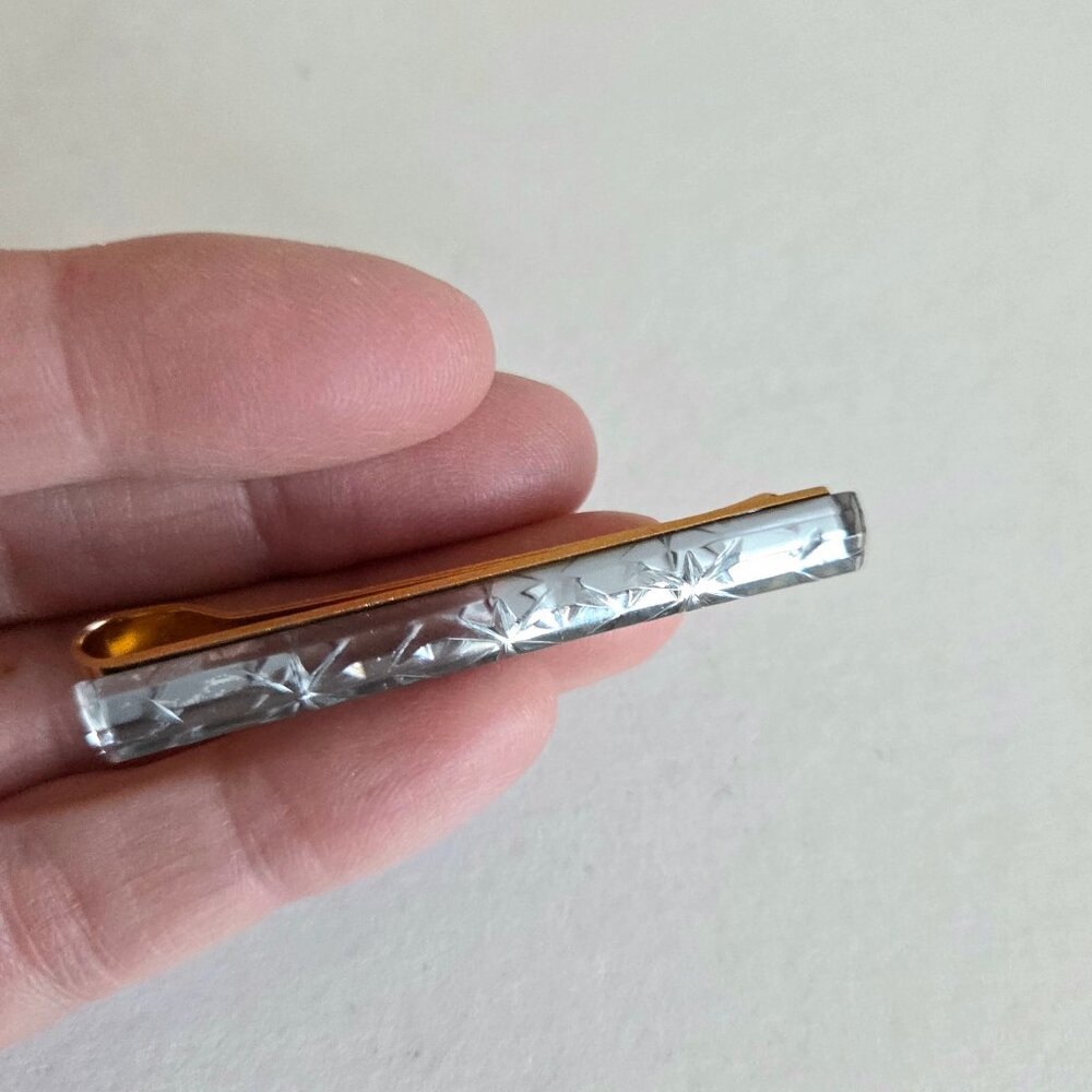 Vintage gold tone metal and clear carved Lucite tie clip bar. Men's accessories.